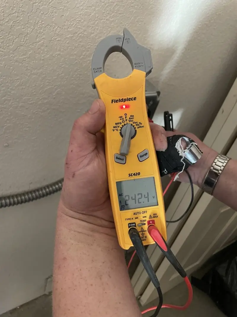 Voltage testing with clamp meter during Ceiling Fan Installation in Bellview